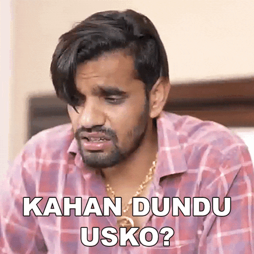 a man in a plaid shirt is making a funny face and says kahan dundu usko ?
