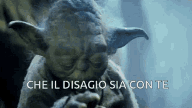 yoda is smoking a cigarette with the words che il disagio sia con te written below him
