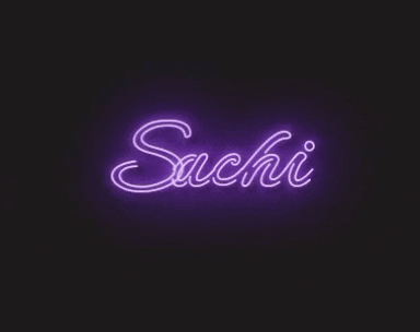 a purple neon sign that says sachi on a black background .