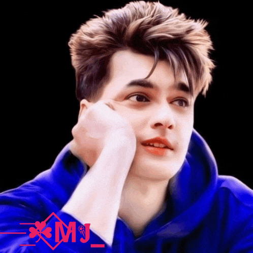 a young man in a blue hoodie has a red xmj logo on the bottom right