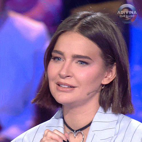 a close up of a woman 's face with the word adivina on it