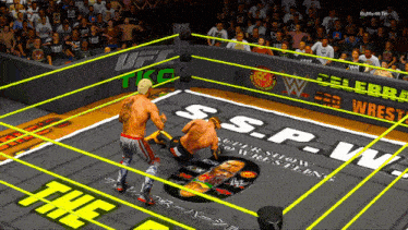 two wrestlers in a wrestling ring with s.s.p.w. written on the floor