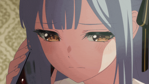 a close up of a girl 's face with blue hair and brown eyes