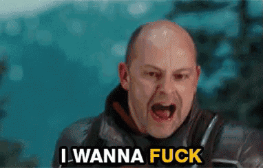 a bald man is screaming with the words `` i wanna fuck '' above him .
