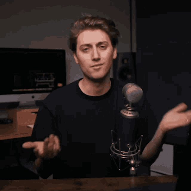 a man in front of a microphone with the words that was really cool below him