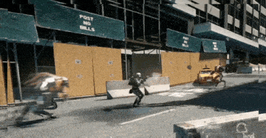 a building under construction has a post no bills sign on it