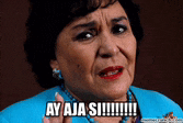 a woman in a blue shirt with the words ay aja si written on her face