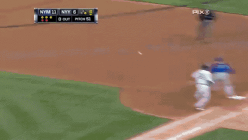 a baseball game is being played in front of a mcdonald 's sign