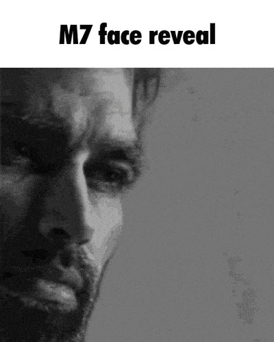 a black and white photo of a man with a beard and the words `` m7 face reveal '' written below him .