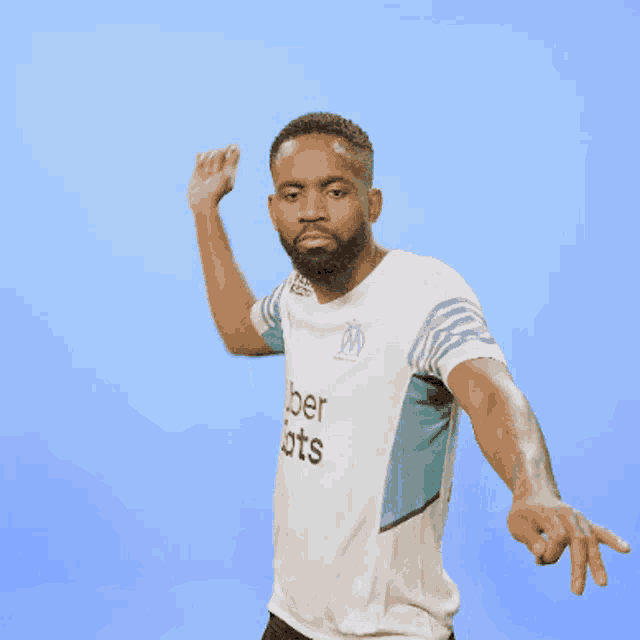 a man with a beard wearing a shirt that says ts on it