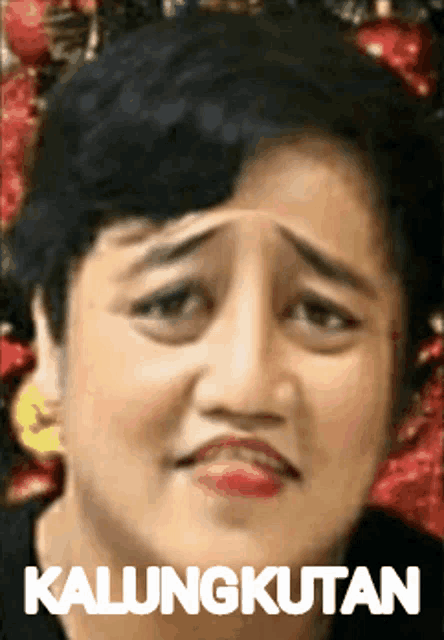 a woman with a sad look on her face and kalungkutan written on the bottom