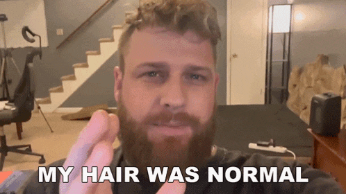 a man with a beard is saying that his hair was normal