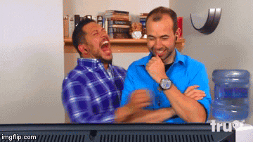two men are laughing in front of a tv that says imgflip.com
