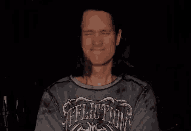 a man wearing a shirt that says reflection on it