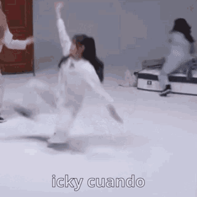 a woman is dancing on a white surface with the words icky cuando written below her .