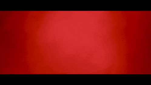 a red background with a black border and a blurred texture