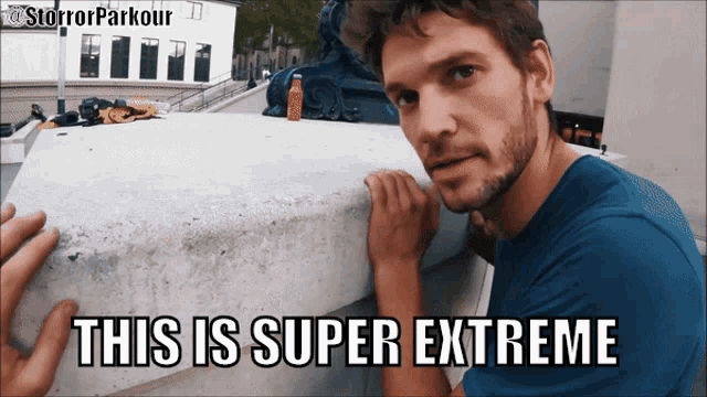 a man leaning on a concrete wall with the caption " this is super extreme " on the bottom