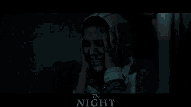 a movie poster for the night with a woman crying