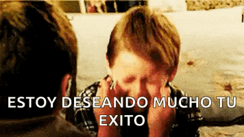 a boy is covering his face with his hands and the words estoy deseando mucho tu exito are next to him