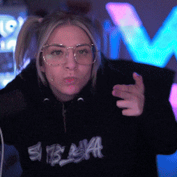 a woman wearing glasses and a black hoodie that says si blaa on it