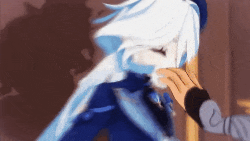 a person is touching a person 's face in a video game .