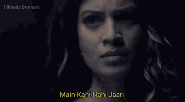 a close up of a woman 's face with the words main kahi nahi jaari on the bottom