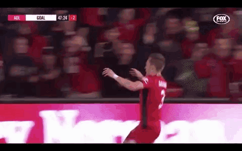a man in a red jersey with the number 3 on it