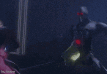 a blurred image of a person holding a light saber in the dark .