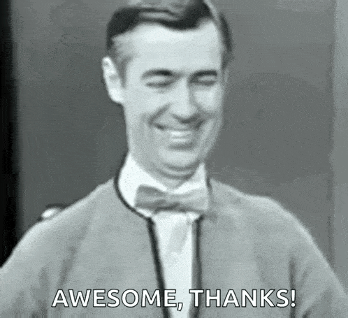 a man in a suit and bow tie is smiling and saying `` awesome thanks '' .