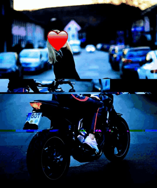 a woman sits on a motorcycle with a license plate that says bot