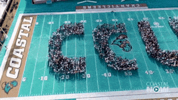 an aerial view of a football field with the word coastal written on it