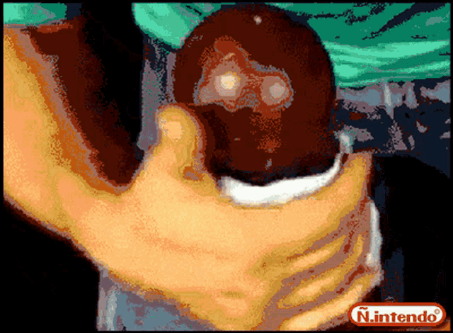 a pixelated image of a person holding another person with the nintendo logo in the corner