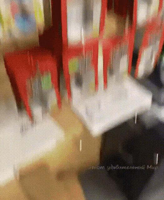 a blurred image of a room with a few boxes on a table and a few boxes in the background
