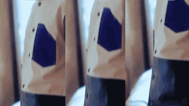 a close up of a person wearing a white shirt with blue pockets