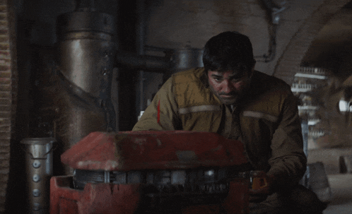 a man working on a machine with the words sad noises