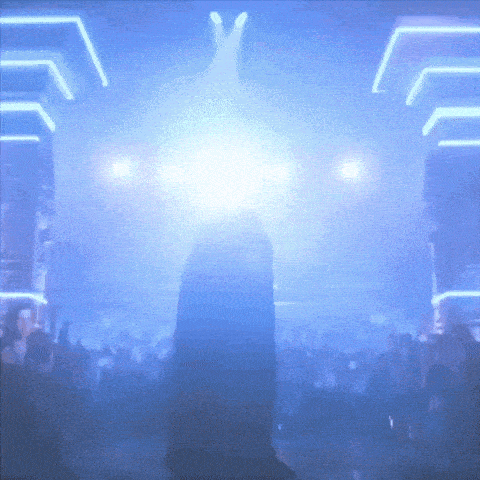 a person in a dark room with blue lights