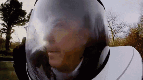 a close up of a person wearing a helmet with a bbc logo in the background