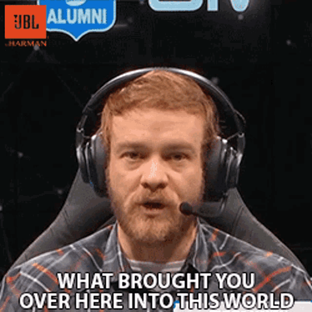 a man wearing headphones and a plaid shirt says what brought you over here into this world