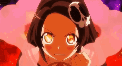 a girl with a skull on her head is looking at the camera