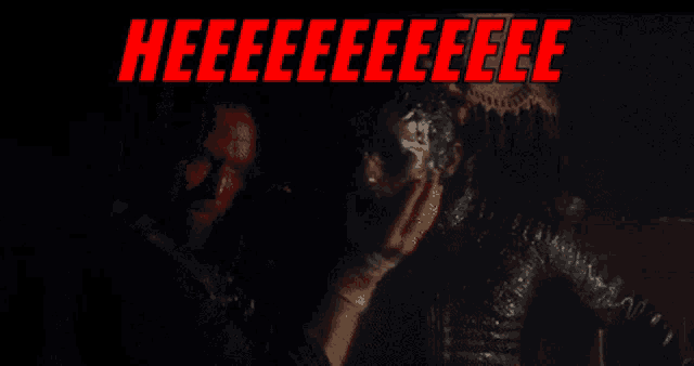 a black background with red text that says heeeee