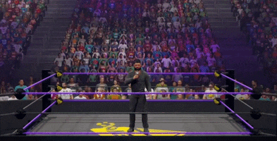 a man in a wrestling ring has a sign that says this is wrestling
