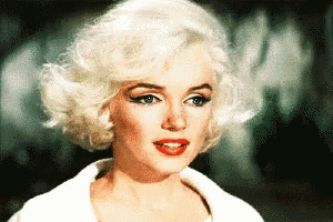 a close up of a woman 's face with blonde hair