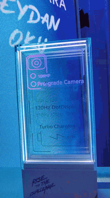 a display of a phone with the words rise to the challenge on it
