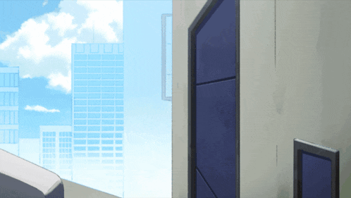 a building with a blue door and a blue sky with clouds