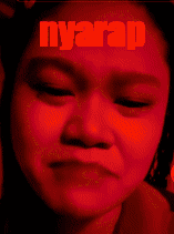 a close up of a woman 's face with the word nyarap written on her forehead