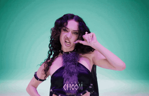 a woman in a purple dress with choom written on it