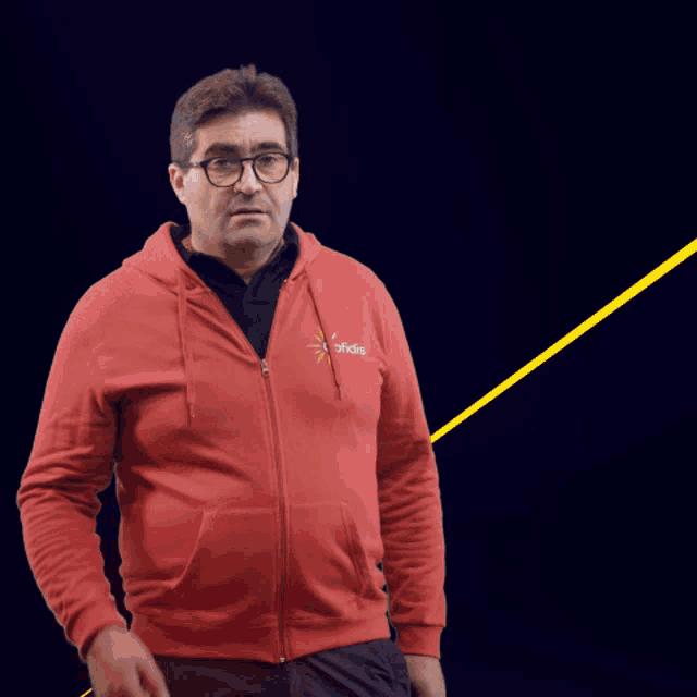 a man wearing a red hoodie that says tcho