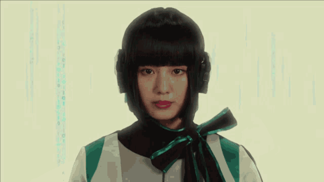 a close up of a woman wearing headphones and a green shirt