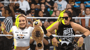 two women in a wrestling ring one wearing a shirt that says reet on it