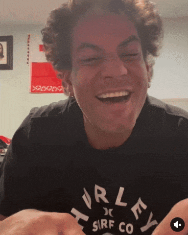 a man wearing a hurley surf co shirt is smiling